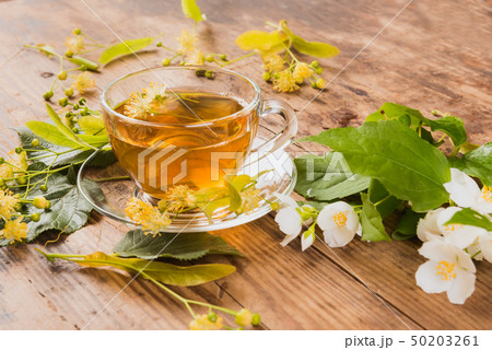 Cup of tea linden jasmine on wooden background 50203261
