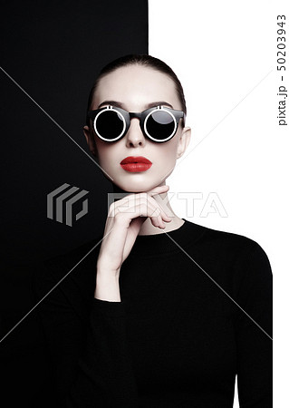 beautiful young woman with black sunglasses 50203943