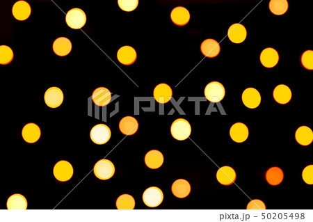 Unfocused abstract yellow bokeh on black Unfocused abstract yellow bokeh on black 50205498