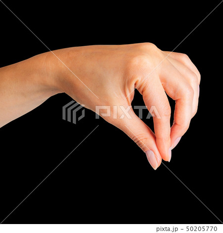 Woman hand holding something little with two fingers 50205770