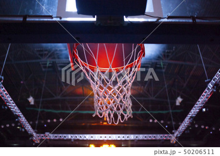basketball hoop in red neon lights in sports arena 50206511