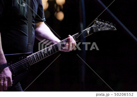guitarist on stage during concert guitarist on stage during concert 50206552