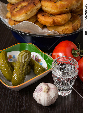 Belyashi, Tomatoes, Pickled cucumbers, Garlic, Vodka glass 50206585