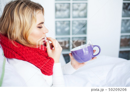 Flu. Woman Suffering From Cold Lying In Bed Flu. Woman Suffering From Cold Lying In Bed 50209206