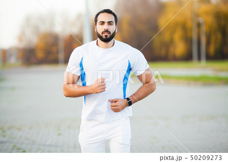 Fitness. Young man running in urban environment Fitness. Young man running in urban environment 50209273