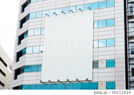Large blank billboard on a street wall, banners 50211034
