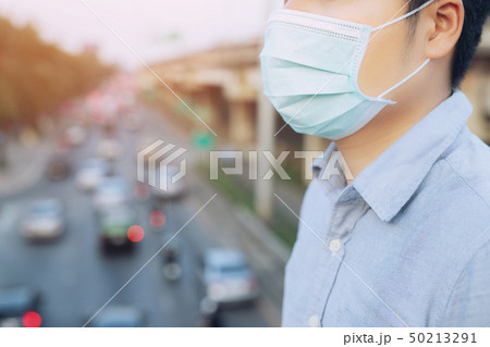 Portrait of man wearing facial hygienic mask nose Portrait of man wearing facial hygienic mask nose 50213291