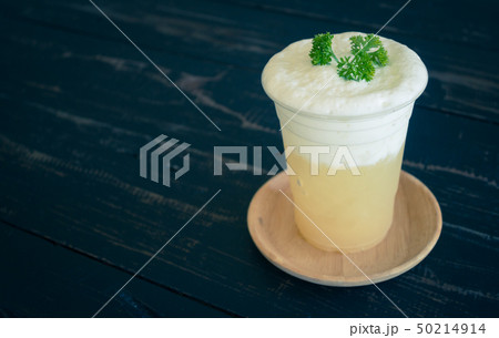 Pineapple juice with Milk froth and Parsley Right Pineapple juice with Milk froth and Parsley Right 50214914