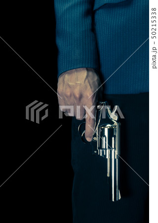 Vintage Man Hold Stainless Gun or Shooter in Hand 50215338