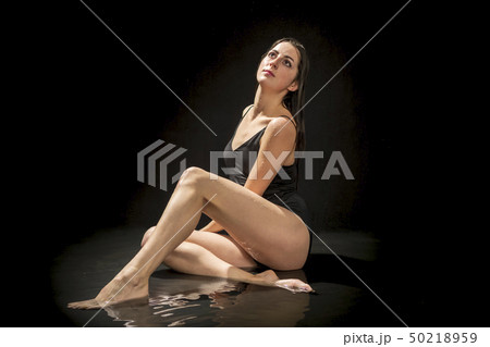 portrait of woman sitting in the water portrait of woman sitting in the water 50218959