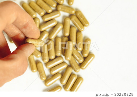 hand holding medication 50220229