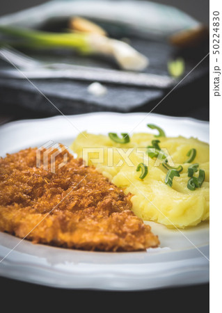 Chicken steak or schnitzel with mashed potatoes 50224830