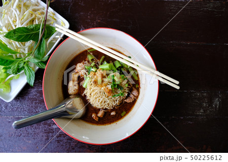 Noodle Soup with pork meat and vegetable on Wood Noodle Soup with pork meat and vegetable on Wood 50225612