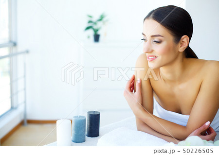 Spa treatments.Beautiful Woman In A Spa Salon. Relax and skin Cleansing. Woman Lying on a Bed in Spa Spa treatments.Beautiful Woman In A Spa Salon. Relax and skin Cleansing. Woman Lying on a Bed in Spa 50226505