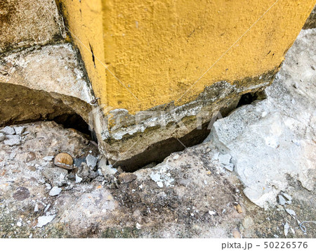 The cement floor collapsed and saw the crevices 50226576