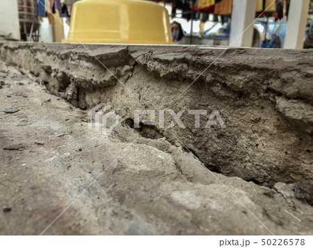 The cement floor collapsed and saw the crevices 50226578