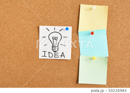light bulb with word idea and colored blank notes 50226983
