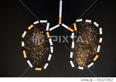 Stop smoking concept on background with broken cigarettes. Heap of cigarettes. No smoking Stop smoking concept on background with broken cigarettes. Heap of cigarettes. No smoking 50227002