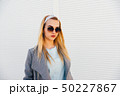 portrait of young woman in sunglasses 50227867