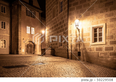 Medieval houses and old drinking fountain in Golden Lane by night, Prague Castle, Czech Republic 50229508