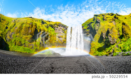 Skogafoss - one of the most beautiful waterfalls on sunny day with rainbow, Skogar, Iceland 50229554