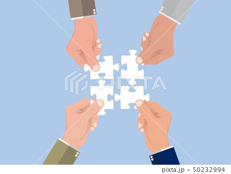 Businessman's hands connecting puzzle pieces Businessman's hands connecting puzzle pieces 50232994