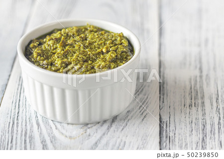 Bowl of pesto on the wooden table 50239850