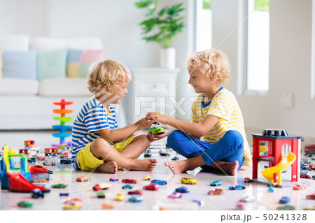 Kids play with toy cars. Children playing car toys Kids play with toy cars. Children playing car toys 50241328
