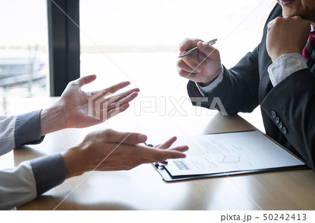 Employer arriving for a job interview, businessman 50242413