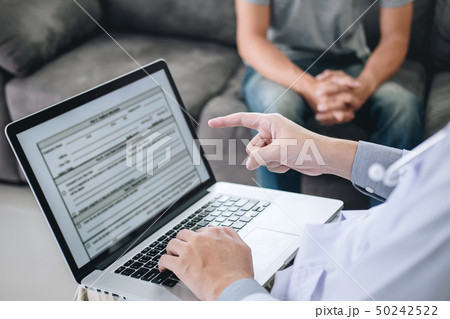 Professional doctor in white uniform gown coat and 50242522