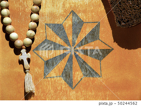 Russian prison symbol beads bread wooden backgroun Russian prison symbol beads bread wooden backgroun 50244562
