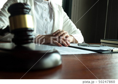 Lawyer working on the table in office. 50247860
