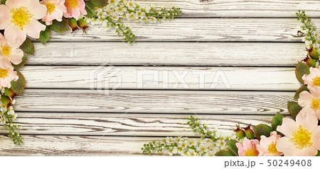 Wild rose flowers corner arrangements on wood 50249408