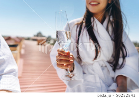 flirting couple with sparkling wine on a roof 50252843