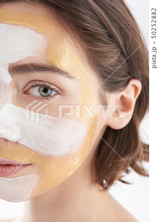 Pretty calmly looking woman with face mask Pretty calmly looking woman with face mask 50252882