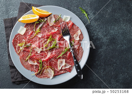 Marbled beef carpaccio with arugula. Marbled beef carpaccio with arugula. 50253168