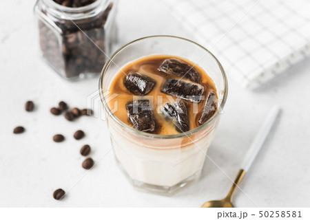 Ice coffee with milk on concrete background Ice coffee with milk on concrete background 50258581