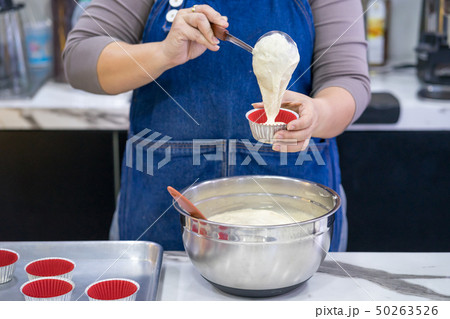 woman making cake in the room 50263526