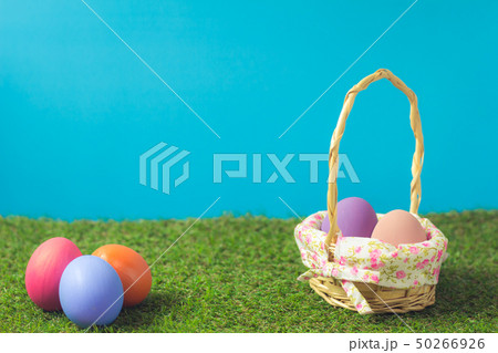Easter eggs in a basket weave wood on the green Easter eggs in a basket weave wood on the green 50266926