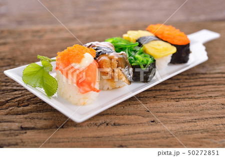 Sushi Set nigiri and sashimi served in long white Sushi Set nigiri and sashimi served in long white 50272851