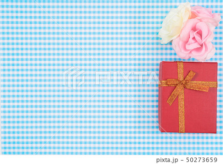 gift box with red isolated on Plaid background. gift box with red isolated on Plaid background. 50273659