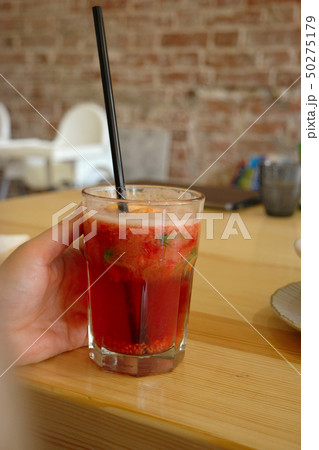 Woman with cold tea with fruits Woman with cold tea with fruits 50275179