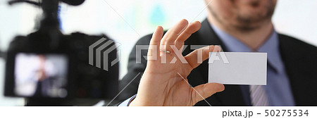 Bisnessman hold business card in hand Bisnessman hold business card in hand 50275534