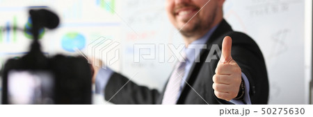 Male in suit and tie show confirm sign Male in suit and tie show confirm sign 50275630