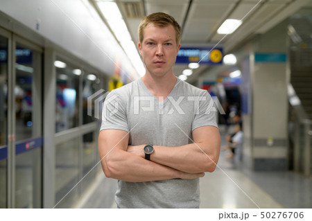 Young handsome tourist man at the underground train station in Bangkok 50276706