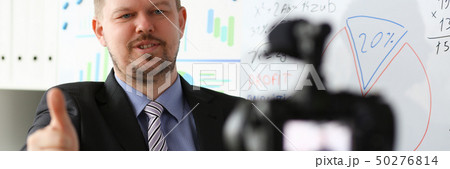 Male in suit and tie show confirm sign 50276814