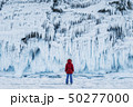 The girl on the background of the ice wall 50277000