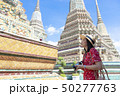 Asian woman is enjoy traveling inside Wat Pho  50277763