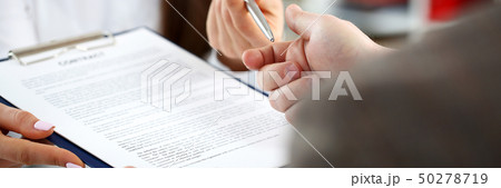 Female arm offer contract form on clipboard pad 50278719