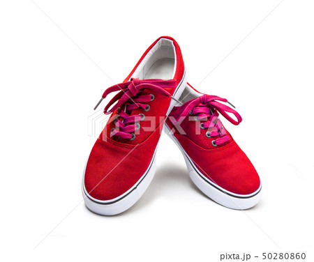 A pair of red color canvas shoes isolated on white 50280860